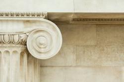 Decorative detail of an ancient Ionic column. Close up.